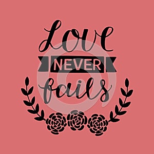 Hand lettering with bible verse Love never fails made with flowers on pink background