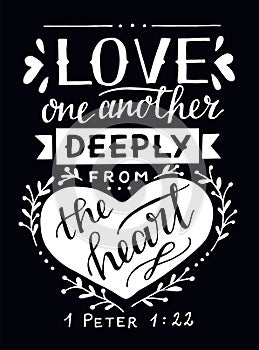 Hand lettering with bible verse Love one another deeply from the heart on black background. photo