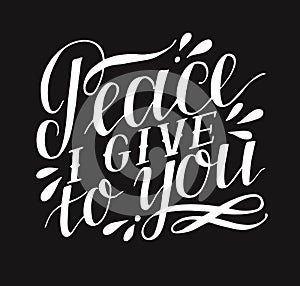 Hand lettering with bible verse Peace I give to you on black background.