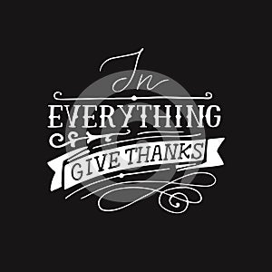 Hand lettering with bible verse In everything give thanks on black background. photo