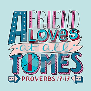 Hand lettering with bible verse A Friend loves at all times. Proverbs photo