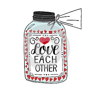 Hand lettering Love each other, made on pot with hearts.