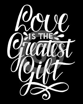 Hand lettering Love is the greatest gift on black background. photo
