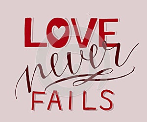 Hand lettering with bible verse Love never fails . photo