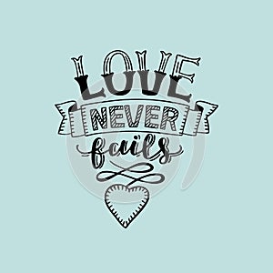 Hand lettering Love never fails with heart on blue background photo
