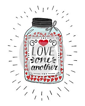 Hand lettering Love one another, made on pot with hearts.
