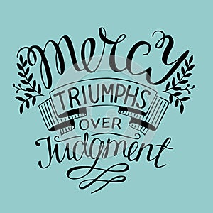 Hand lettering Mercy triumphs over judgment. photo