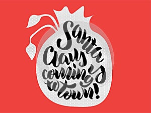 Hand lettering `Santa Claus is coming to town`