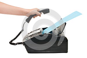 Hand lifts the receiver a fax