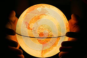 Hand on light globe