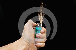 Hand with lighter igniting