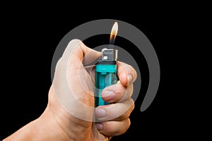 Hand with lighter igniting photo