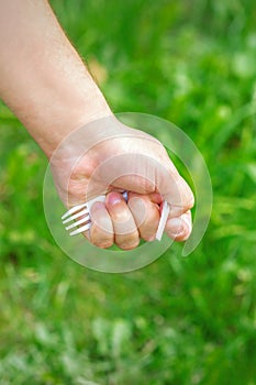 Hand of a little girl holding plastic trash