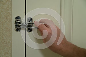 Hand locking lock on hotel door