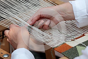 Hand loom weaver's hands photo