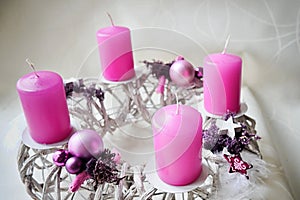 Hand made advent wreatch with pink christmass balls and candles