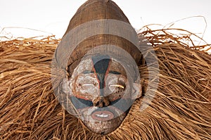 Hand made African mask with ropes simulating hair. Human face. I