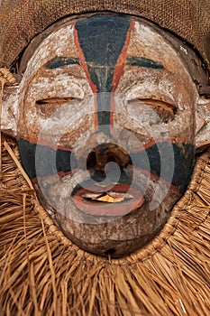 Hand made African mask with ropes simulating hair. Human face. I