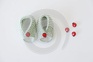 Hand made baby bootees with ladybug buttons
