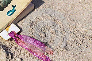 Hand made bookmarks on the sand