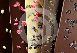 Hand-made chocolate bars (with candied petals) photo