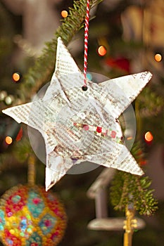 Hand made Christmas star on a Christmas tree