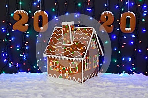 The hand-made eatable gingerbread house, 2020 inscription, snow decoration