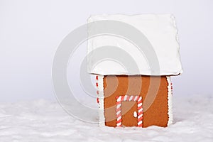 The hand-made eatable gingerbread house and snow