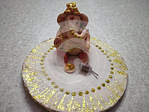 Hand made ganpati ji with mouse and lado photo