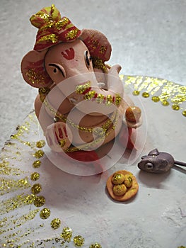 Hand made ganpati ji with mouse and lado photo