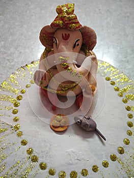 Hand made ganpati ji with mouse and lado photo