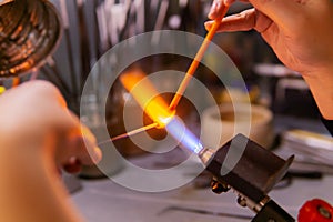 Hand-made glass beadmaking in a glass-blowing workshop
