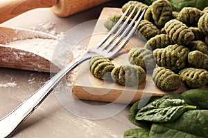 Hand made gnocchi with fresh Spinach. italian traditional gnocchi on background