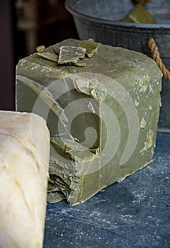 Hand made from natural ingredients and oils soap in blocks in shop close up