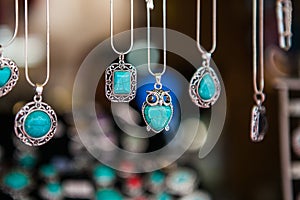 Hand made oval pendants with turquoise stone in a