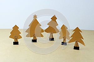 Hand made paper Christmas trees with binder clip