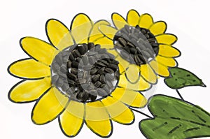 Hand-made picture of lovely sunflower. Painted with yellow and green gouache and glued black seeds. Art on the white background