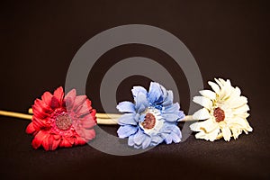 Hand Made plastic flowers, in primary colour