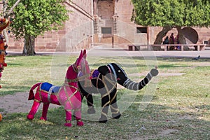 Hand made Rajasthani colourful dolls of horse and elephant displayed for sale at Mehrangarh Fort, Jodhpur, Rajasthan. Famous for