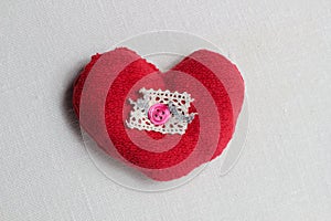 Hand made red heart close up on light background with red ribbon, Valentine day postcard,holiday wallpaper,cover design