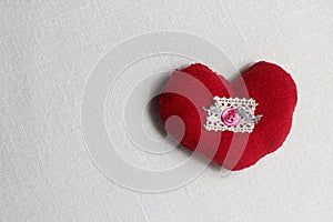 Hand made red heart close up on light background with red ribbon, Valentine day postcard,holiday wallpaper,cover design