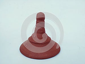 Hand Made Sand or Clay Red Glass Lid or Cap isolated on White Background