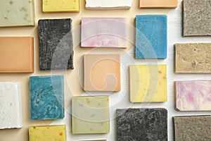 Hand made soap bars on color background