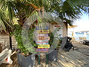 Hand made painted wooden signs of beach life. photo