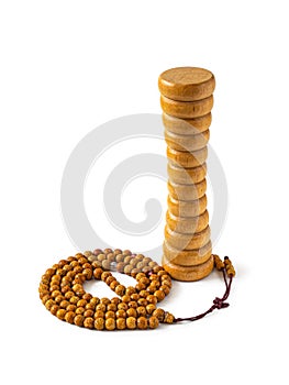 Hand made wooden massager and Buddhist rosary on white background