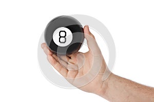 Hand with magic billiard ball number eight