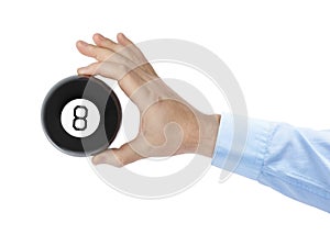 Hand with magic billiard ball number eight