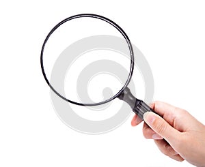 Hand with magnifying glass photo