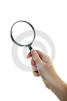 Hand with a magnifying glass
