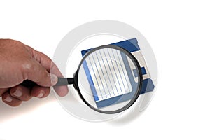 magnifying glass on floppy disk